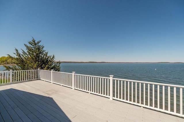 wooden terrace with a water view