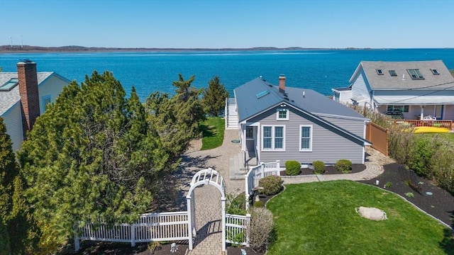 birds eye view of property with a water view