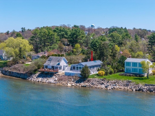 aerial view featuring a water view and a view of trees