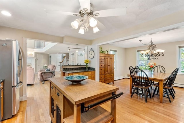 13 Lisa Ln, Georgetown, MA 01833 - kitchen with freestanding refrigerator, light wood-type flooring, baseboard heating, dark countertops, and recessed lighting