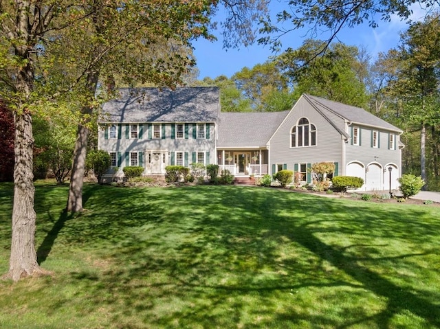13 Lisa Ln, Georgetown, MA 01833 - colonial inspired home with a front lawn, a porch, and an attached garage