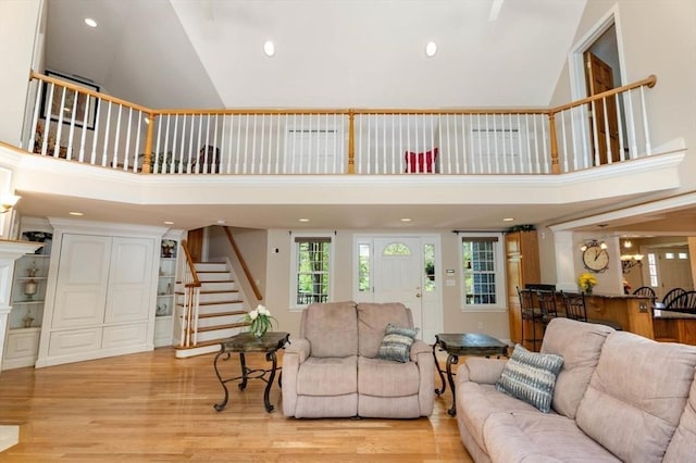 13 Lisa Ln, Georgetown, MA 01833 - living area with stairway, high vaulted ceiling, light wood-style flooring, and recessed lighting