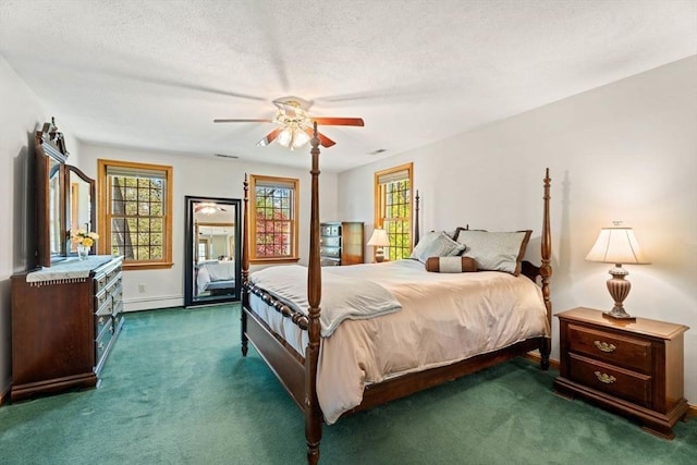 13 Lisa Ln, Georgetown, MA 01833 - bedroom with a baseboard heating unit, carpet flooring, baseboards, ceiling fan, and a textured ceiling