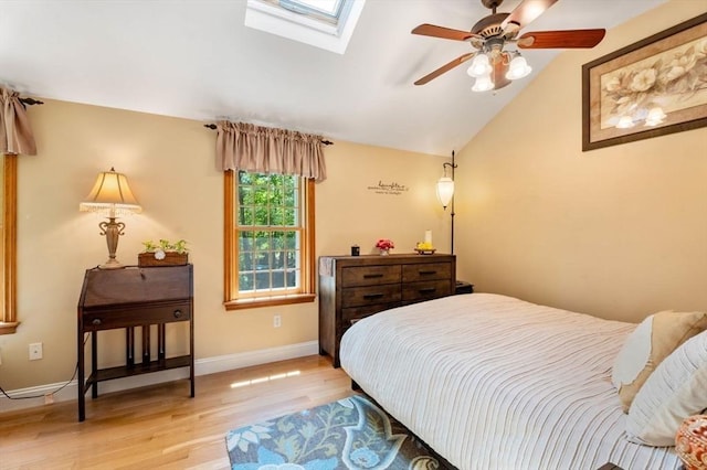 13 Lisa Ln, Georgetown, MA 01833 - bedroom featuring a skylight, light wood-style floors, lofted ceiling, baseboards, and a ceiling fan