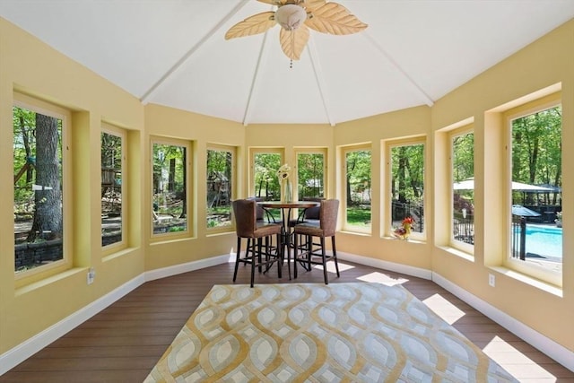 13 Lisa Ln, Georgetown, MA 01833 - sunroom featuring wood finished floors, baseboards, and lofted ceiling