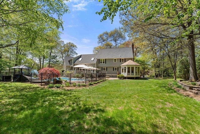 13 Lisa Ln, Georgetown, MA 01833 - rear view of house with a gazebo and a sunroom