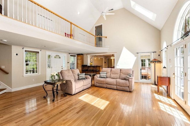 13 Lisa Ln, Georgetown, MA 01833 - living area featuring high vaulted ceiling, light wood finished floors, healthy amount of natural light, and ceiling fan