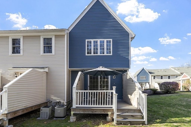 51 Fox Meadow Rd Unit A, Leominster, MA 01453 - back of house with a wooden deck, a yard, and central AC