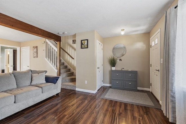 51 Fox Meadow Rd Unit A, Leominster, MA 01453 - living area with dark wood-style floors, baseboards, and stairway