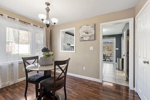 51 Fox Meadow Rd Unit A, Leominster, MA 01453 - dining space with wood finished floors, baseboards, and a chandelier