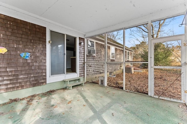 unfurnished sunroom with cooling unit