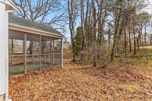 view of yard featuring a sunroom