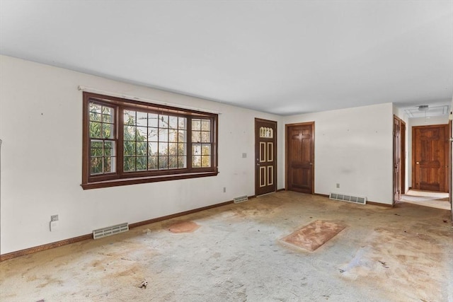 interior space featuring carpet floors, visible vents, and baseboards