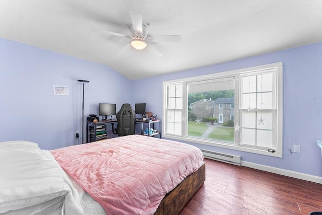18 Cannongate Rd Unit 68, Tyngsborough, MA 01879 - bedroom featuring vaulted ceiling, wood finished floors, baseboard heating, baseboards, and a ceiling fan