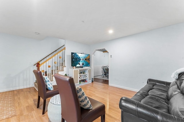 18 Cannongate Rd Unit 68, Tyngsborough, MA 01879 - living room featuring light wood finished floors, baseboards, stairs, and arched walkways