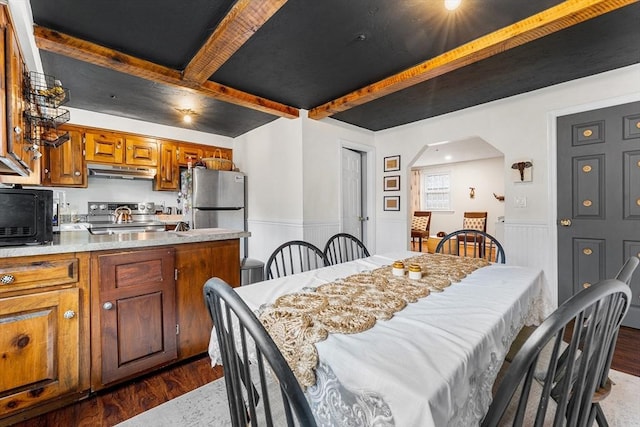 18 Cannongate Rd Unit 68, Tyngsborough, MA 01879 - dining space with dark wood-style floors, wainscoting, beam ceiling, and arched walkways