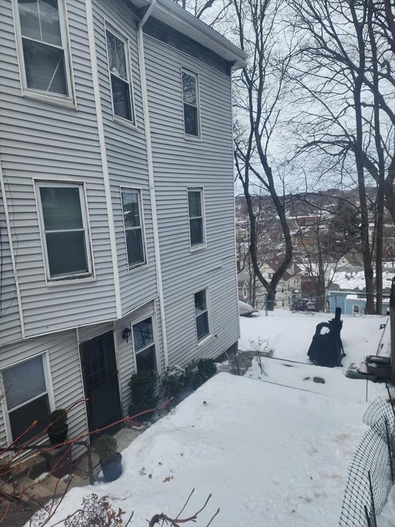 view of snow covered property