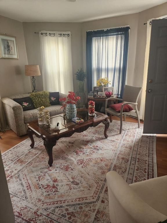 living area with wood finished floors