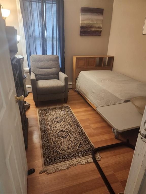 bedroom featuring light wood-style floors