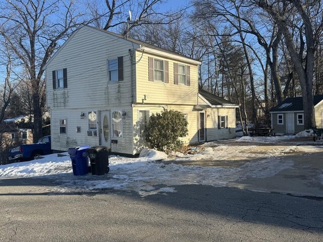 view of front of home with a storage unit