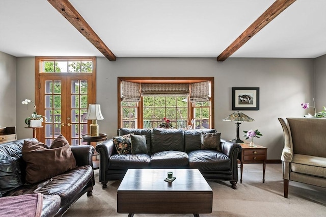 18 E St, Beverly, MA 01915 - living area with light colored carpet, beamed ceiling, french doors, and baseboards