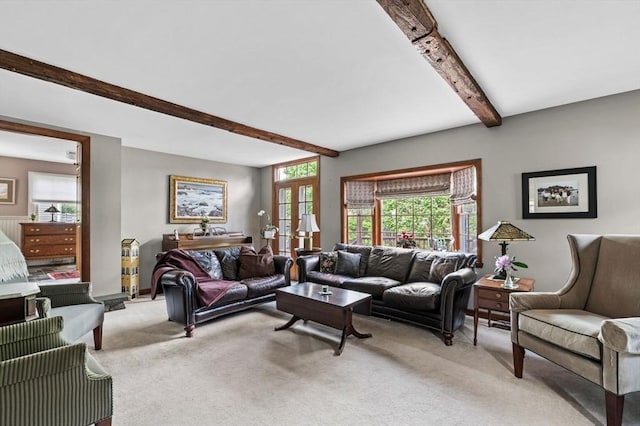 18 E St, Beverly, MA 01915 - living area featuring beam ceiling, light colored carpet, and french doors
