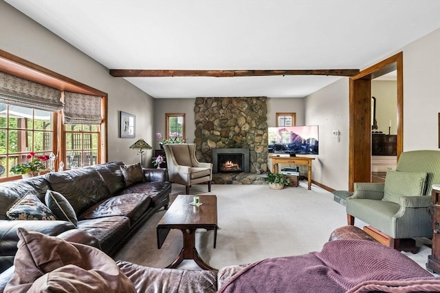 18 E St, Beverly, MA 01915 - carpeted living area with a stone fireplace, baseboards, and beamed ceiling