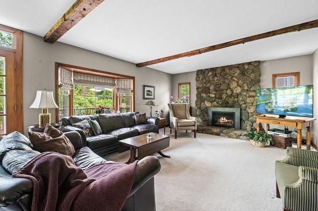 18 E St, Beverly, MA 01915 - living area with beamed ceiling, carpet floors, and a stone fireplace
