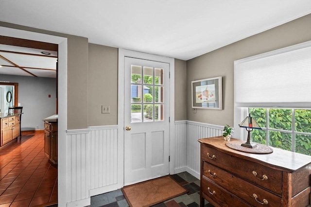 18 E St, Beverly, MA 01915 - doorway with wainscoting and dark tile patterned flooring
