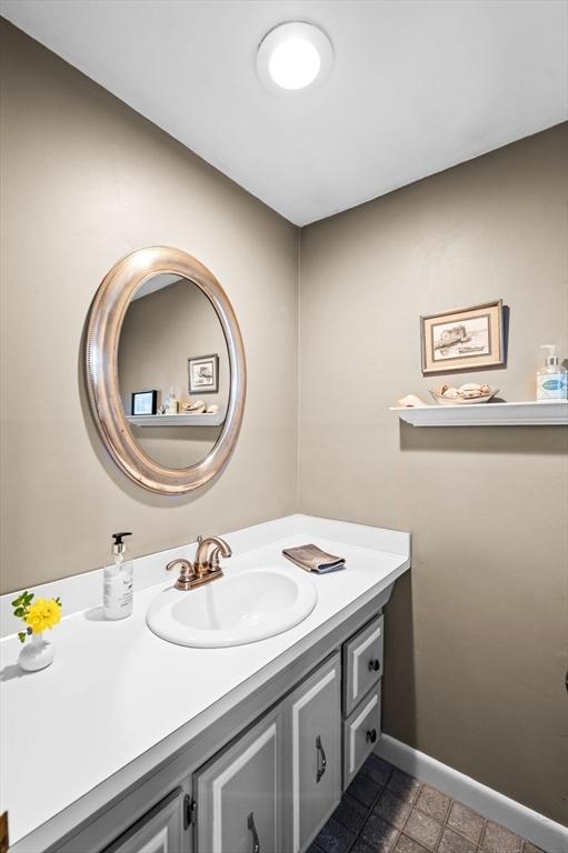 18 E St, Beverly, MA 01915 - bathroom with vanity and baseboards