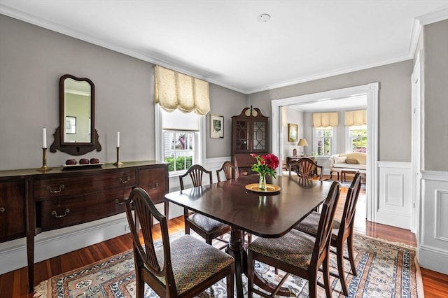 18 E St, Beverly, MA 01915 - dining space with wood finished floors, wainscoting, and crown molding