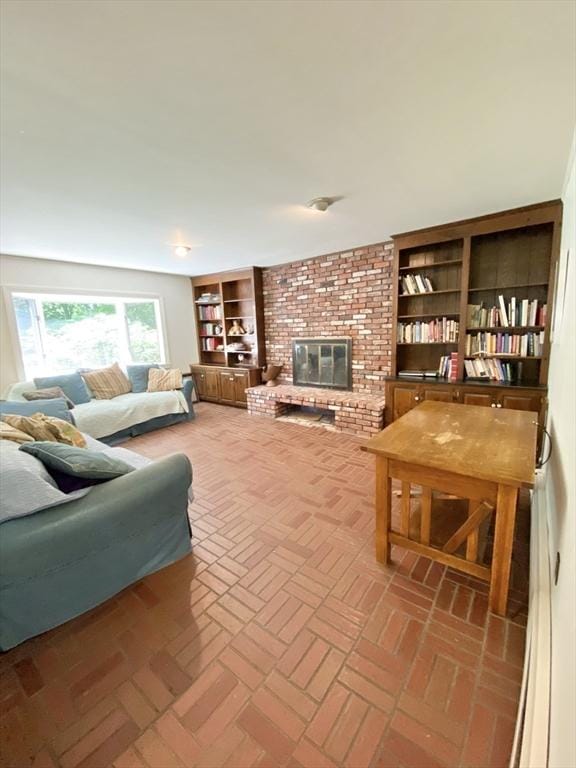 54 Hilltop St, Quincy, MA 02169 - living room with a brick fireplace and brick floors