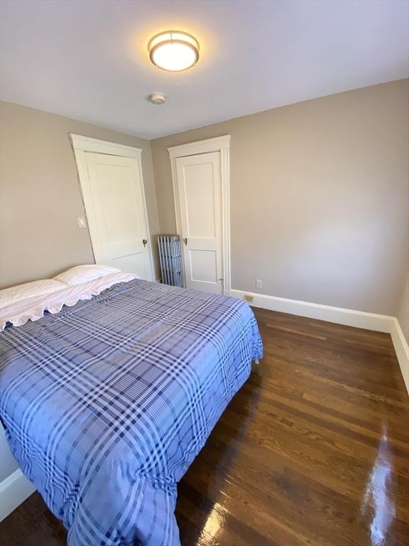 54 Hilltop St, Quincy, MA 02169 - bedroom featuring baseboards, wood finished floors, and a closet