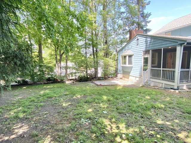 54 Hilltop St, Quincy, MA 02169 - view of grassy yard with a sunroom