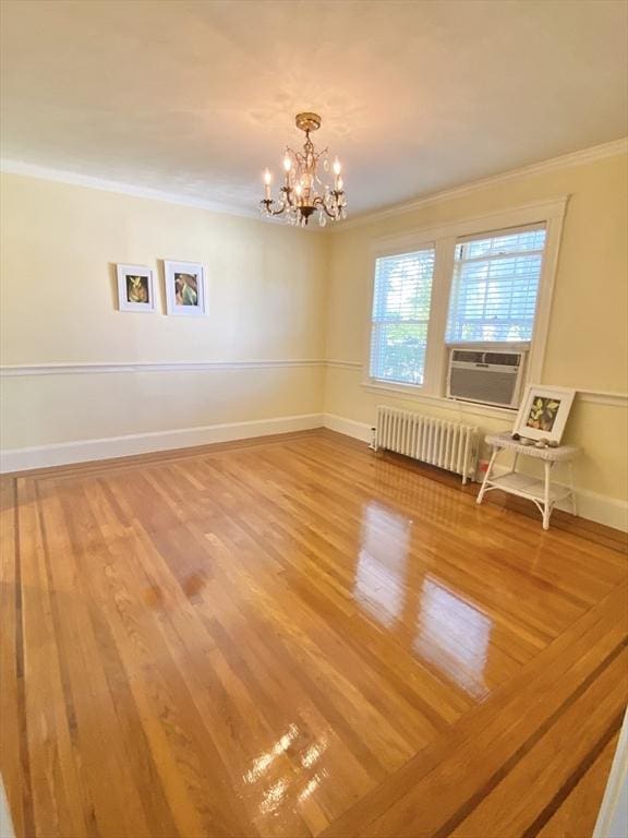 54 Hilltop St, Quincy, MA 02169 - unfurnished room featuring radiator heating unit, ornamental molding, a chandelier, cooling unit, and baseboards