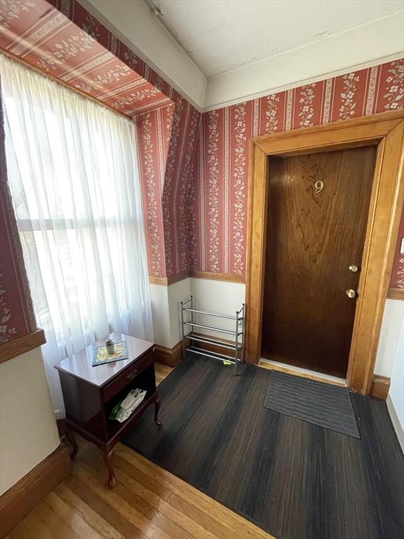 74 Newhall Unit 9, Lynn, MA 01902 - foyer entrance featuring wood finished floors, wallpapered walls, and baseboards
