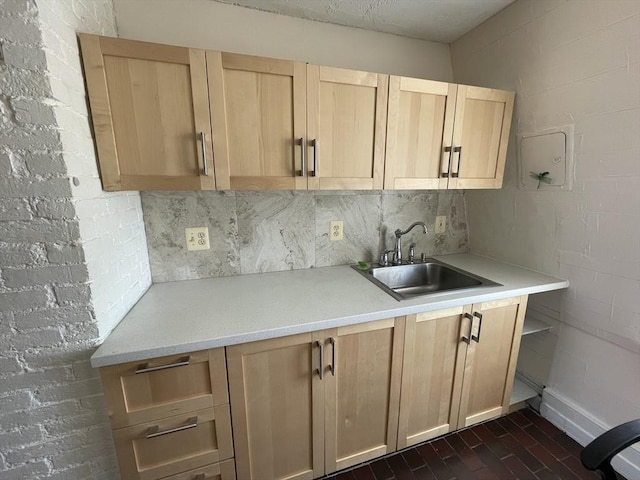 74 Newhall Unit 9, Lynn, MA 01902 - kitchen featuring a sink, light countertops, light brown cabinets, and decorative backsplash