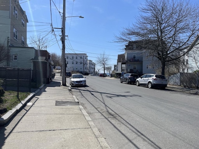 74 Newhall Unit 9, Lynn, MA 01902 - view of asphalt road with sidewalks, street lights, and curbs