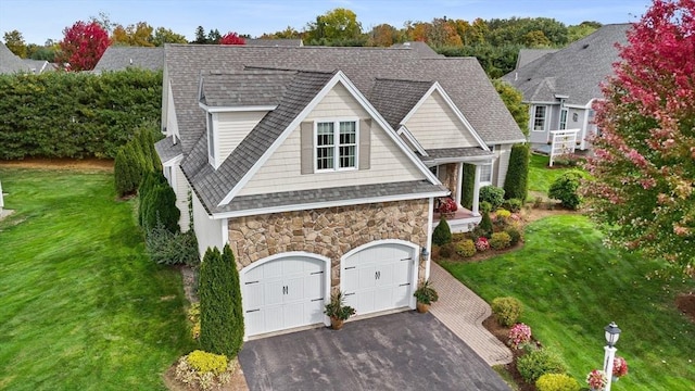 view of front of house with a front yard and a garage