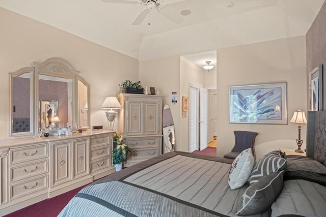 bedroom featuring ceiling fan and a raised ceiling