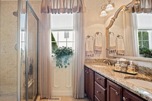 bathroom featuring vanity and walk in shower