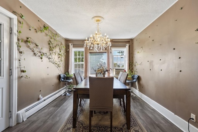 dining area featuring a textured ceiling, an inviting chandelier, wood finished floors, and a baseboard radiator
