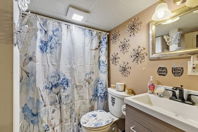 bathroom with vanity, toilet, and a shower with shower curtain