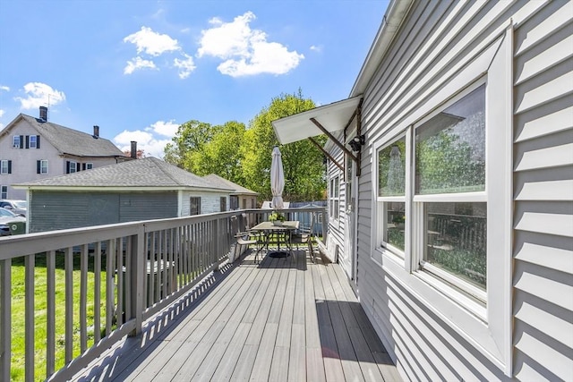 wooden deck featuring outdoor dining area