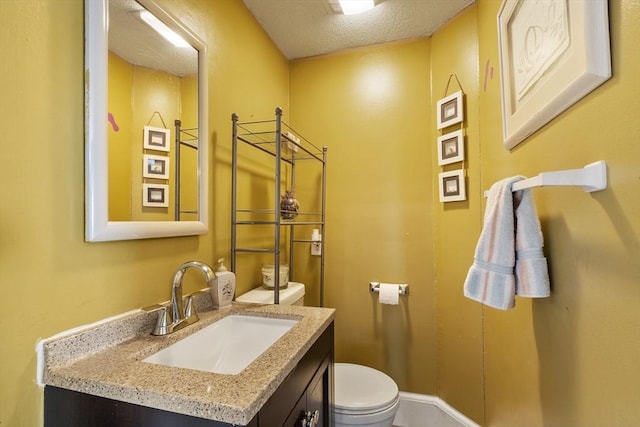 half bath featuring vanity and toilet