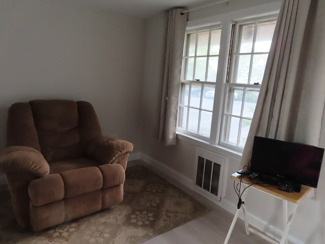 sitting room featuring light hardwood / wood-style floors