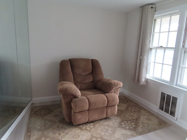 sitting room featuring a healthy amount of sunlight