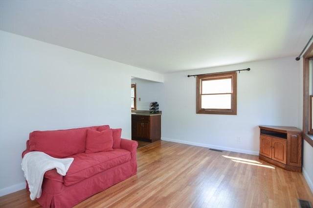 248 Levin Rd, Rockland, MA 02370 - living area with light wood-style floors and baseboards