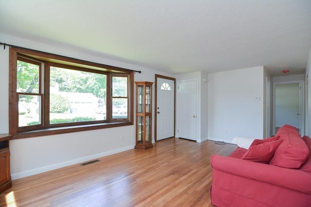 248 Levin Rd, Rockland, MA 02370 - living area with light wood finished floors, baseboards, and plenty of natural light