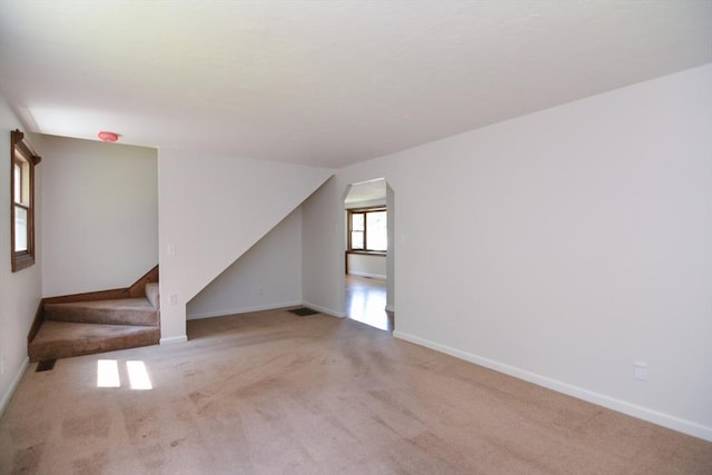 248 Levin Rd, Rockland, MA 02370 - unfurnished living room featuring carpet flooring, stairs, and baseboards